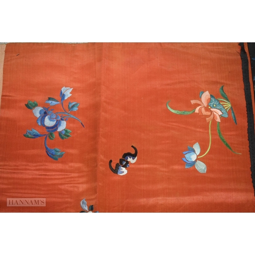 2868 - A LONG 19TH CENTURY CHINESE ORANGE RED SILK EMBROIDERED PANEL decorated with flowers. 190 cm x 57 cm