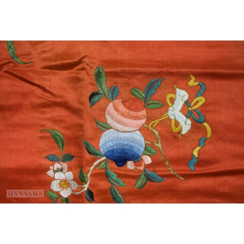 2868 - A LONG 19TH CENTURY CHINESE ORANGE RED SILK EMBROIDERED PANEL decorated with flowers. 190 cm x 57 cm