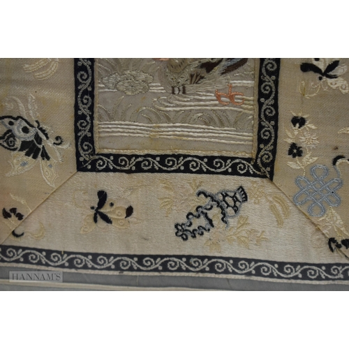 2870 - A PAIR OF 19TH CENTURY CHINESE FRAMED SILK EMBROIDERED PANELS Qing, depicting birds. 67 cm x 34 cm.