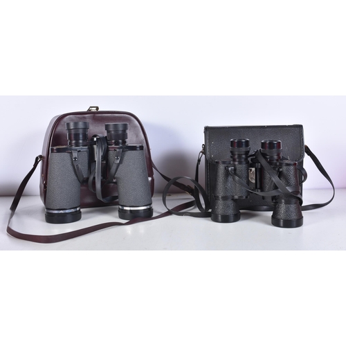 3050 - A cased pair of Bell & Howell Binoculars together with a pair of cased Grantfell binoculars (2).