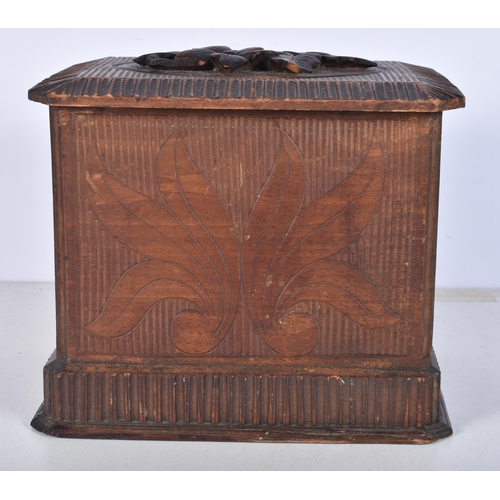 3052 - A carved Black Forest smokers compendium 18.5 x 17 x 22 cm.