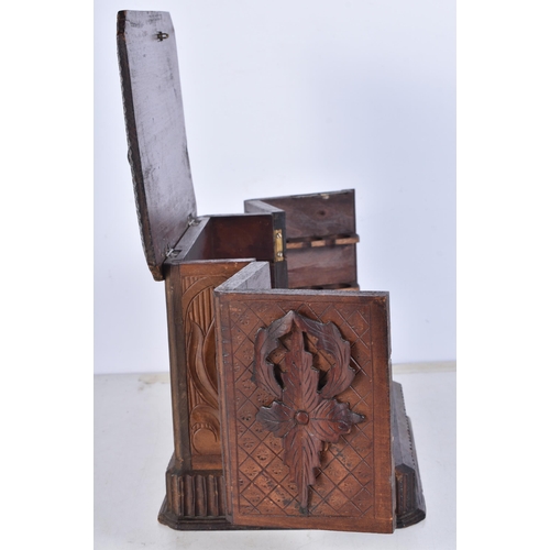 3052 - A carved Black Forest smokers compendium 18.5 x 17 x 22 cm.