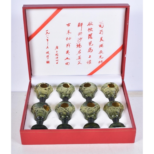 3059 - A boxed set of Chinese Spinach jade glasses 5.5 cm .(8)