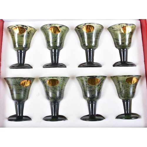 3059 - A boxed set of Chinese Spinach jade glasses 5.5 cm .(8)