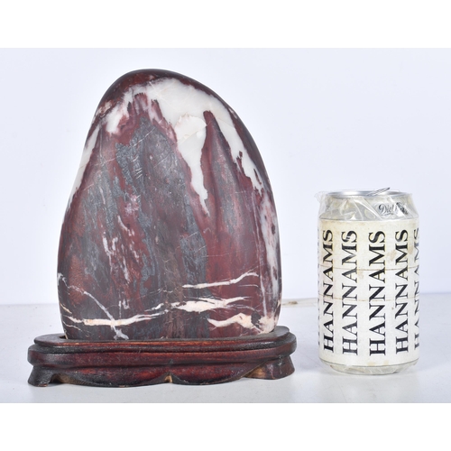 3061 - A polished hardstone boulder with a fitted hardwood stand 20 x 14 cm.