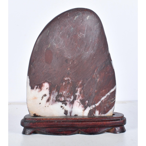 3061 - A polished hardstone boulder with a fitted hardwood stand 20 x 14 cm.