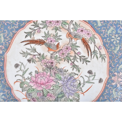 3091 - A large Chinese porcelain charger decorated with birds and foliage 5 x 40cm.