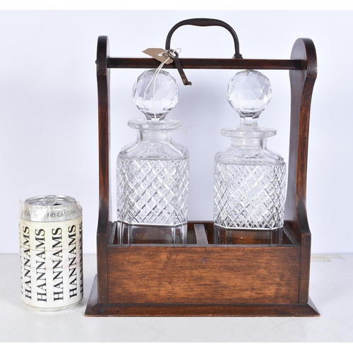 3242 - A vintage 2 crystal decanter Tantalus 29 x 24cm (2).