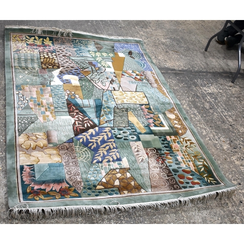 3255 - A hand knotted wool and Bamboo silk Celadon ground rug 182 x 123 cm.