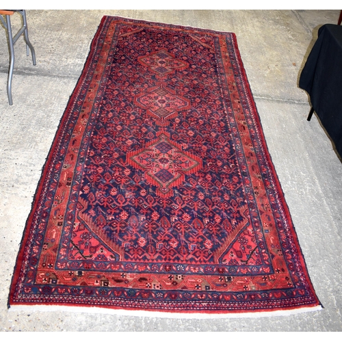 3257 - A hand knotted Persian Long rug 298 x 142