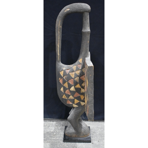 3376 - An African Tribal Senufu wood bird sculpture 120 x 59cm.