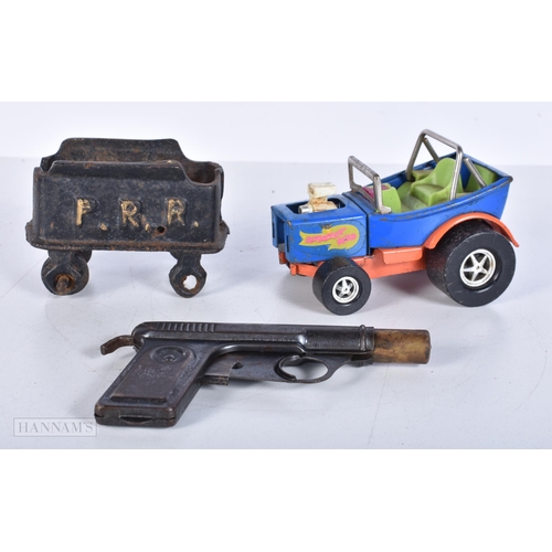 3638 - An antique toy water pistol together with an early cast iron Pacific Railroad model railway stock an... 