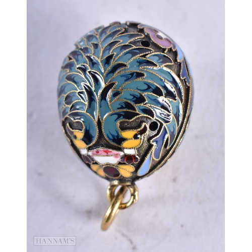 3905 - A Continental Silver and Enamel Egg Pendant. Stamped 84. 2.8cm x 1.8cm, weight 5.3g