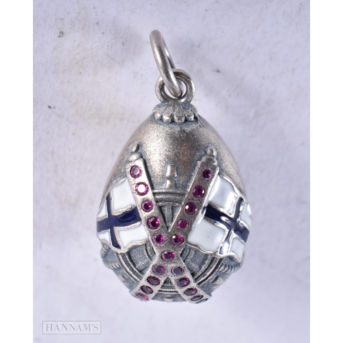 3912 - A Continental Silver and Enamel Egg Pendant. Stamped 84. 2.8cm x 1.6cm, weight 8.5g