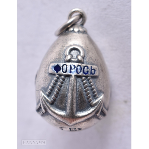 3912 - A Continental Silver and Enamel Egg Pendant. Stamped 84. 2.8cm x 1.6cm, weight 8.5g