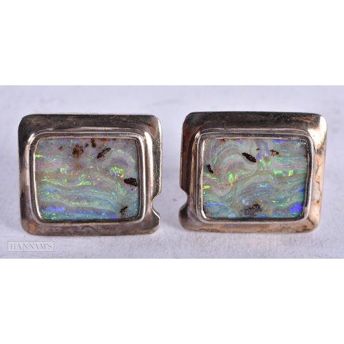 3925 - A Pair of Silver and Opal Cufflinks. Stamped 925, 2.3cm x 2cm, weight 23.7g