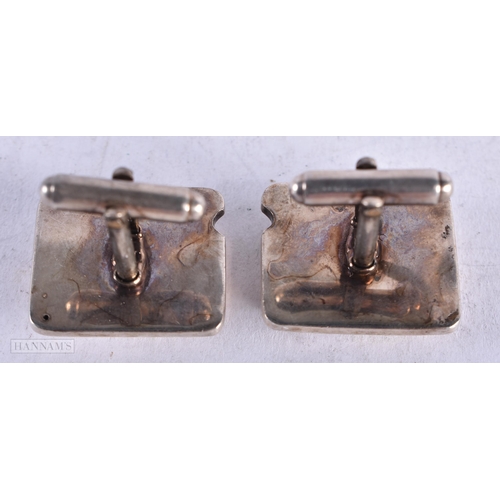 3925 - A Pair of Silver and Opal Cufflinks. Stamped 925, 2.3cm x 2cm, weight 23.7g