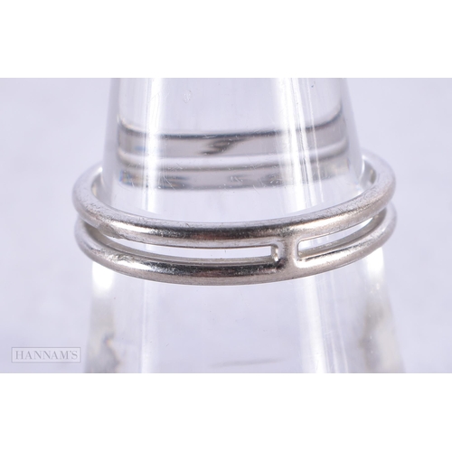 3926 - An 18 Carat White Gold Hermes Ring. Stamped 750. Size N, weight 3.2g