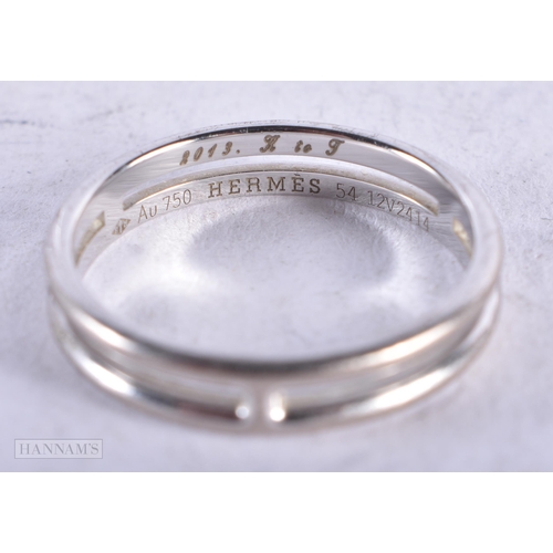 3926 - An 18 Carat White Gold Hermes Ring. Stamped 750. Size N, weight 3.2g