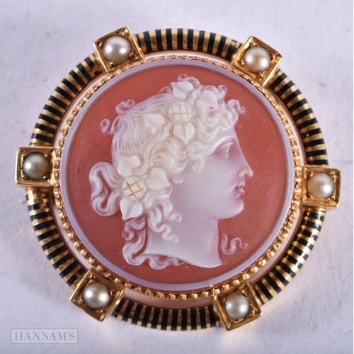 3942 - A Hardstone Cameo Brooch mounted in a High Carat Gold and Black Enamel surround inset with Pearls. 3... 