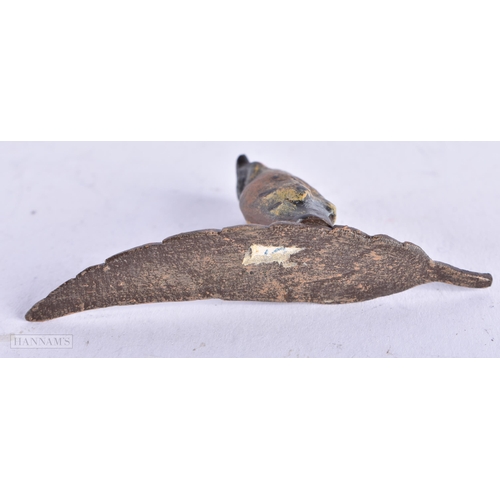 3980 - A Cold Painted Bronze of an Owl standing on a Leaf. 7.1cm x 3.1cm x 1.4cm