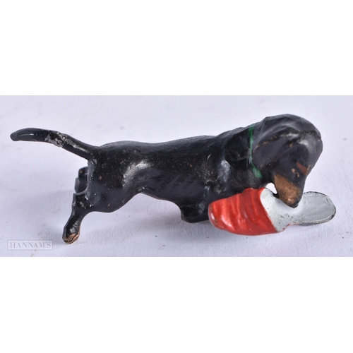 3987 - A Cold Painted Dog with a Slipper. 5.9cm x 2.1cm x 2cm