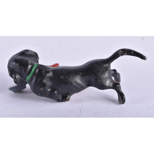 3987 - A Cold Painted Dog with a Slipper. 5.9cm x 2.1cm x 2cm