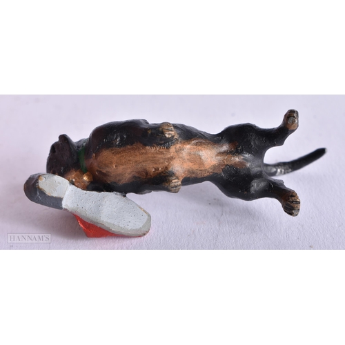 3987 - A Cold Painted Dog with a Slipper. 5.9cm x 2.1cm x 2cm