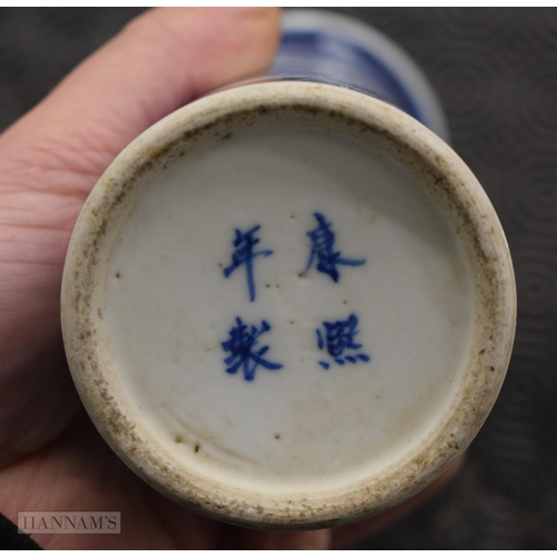 2074 - A 19TH CENTURY CHINESE BLUE AND WHITE PORCELAIN VASE bearing Kangxi marks to base. 21 cm high.