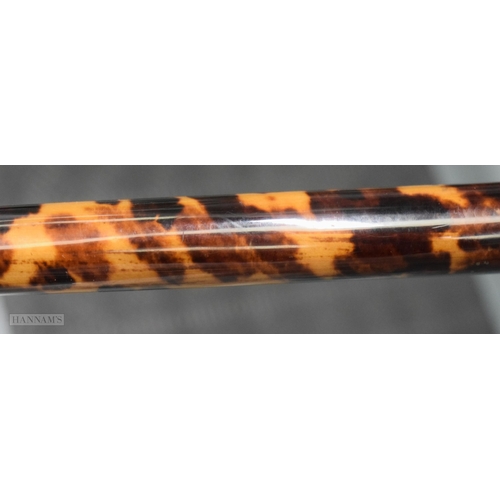 291 - AN EARLY VICTORIAN YELLOW METAL MOUNTED TORTOISESHELL WALKING CANE. 91 cm long.