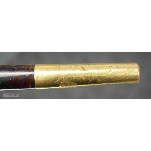 291 - AN EARLY VICTORIAN YELLOW METAL MOUNTED TORTOISESHELL WALKING CANE. 91 cm long.