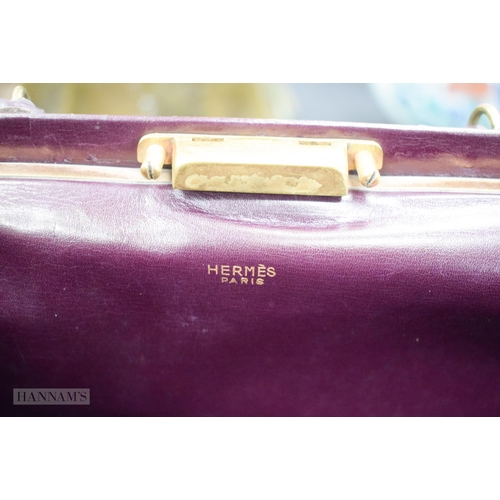 666 - A HERMES LEATHER BAG. 26 cm x 24 cm excluding handle.