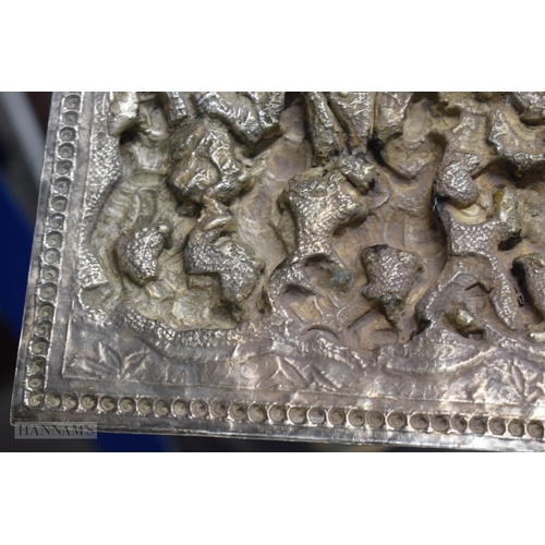 25D - A RARE LARGE 19TH CENTURY INDIAN BURMESE SILVER REPOUSSE PLAQUE decorated with numerous figures in v... 