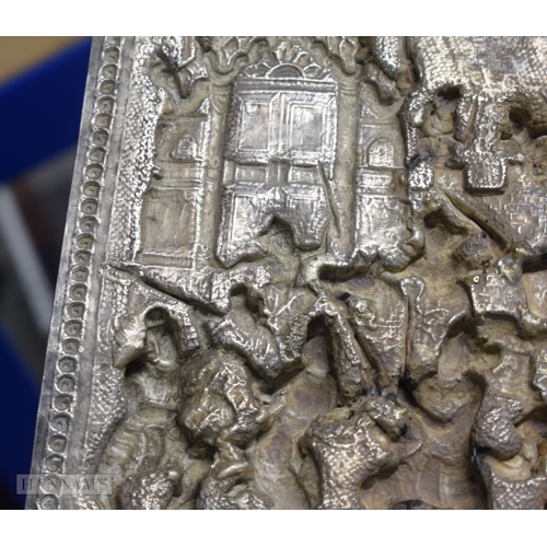 25D - A RARE LARGE 19TH CENTURY INDIAN BURMESE SILVER REPOUSSE PLAQUE decorated with numerous figures in v... 