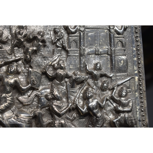 25D - A RARE LARGE 19TH CENTURY INDIAN BURMESE SILVER REPOUSSE PLAQUE decorated with numerous figures in v... 