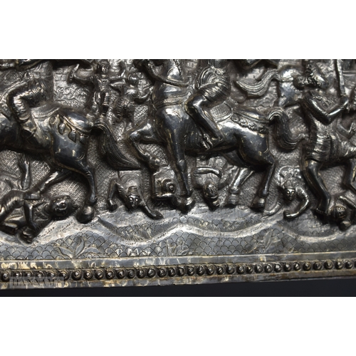 25D - A RARE LARGE 19TH CENTURY INDIAN BURMESE SILVER REPOUSSE PLAQUE decorated with numerous figures in v... 