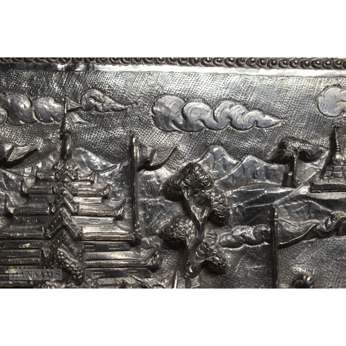 25D - A RARE LARGE 19TH CENTURY INDIAN BURMESE SILVER REPOUSSE PLAQUE decorated with numerous figures in v... 