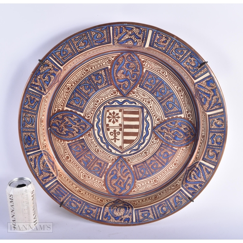 12 - A LARGE 19TH CENTURY HISPANO MORESQUE TIN GLAZED POTTERY CHARGER painted with a shield and motifs. 4... 