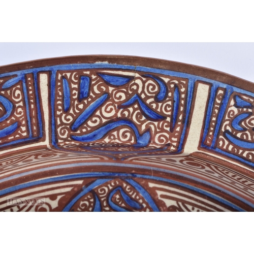 12 - A LARGE 19TH CENTURY HISPANO MORESQUE TIN GLAZED POTTERY CHARGER painted with a shield and motifs. 4... 