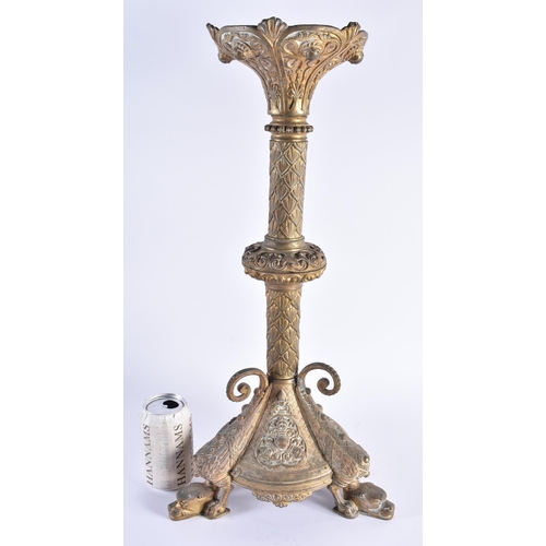 142 - A LARGE 19TH CENTURY CONTINENTAL BRONZE CANDLESTICK decorated with motifs, the feet formed as winged... 