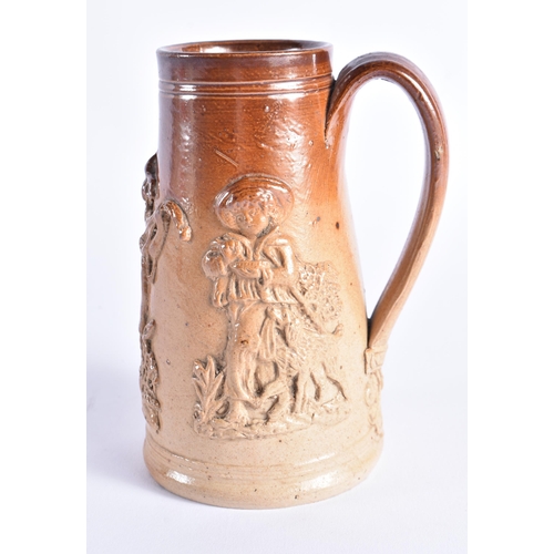 150 - A RARE MID 19TH CENTURY STONEWARE SHAVING MUG decorated with figural sprigs. 14cm high.