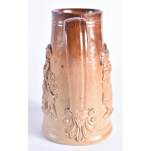 150 - A RARE MID 19TH CENTURY STONEWARE SHAVING MUG decorated with figural sprigs. 14cm high.