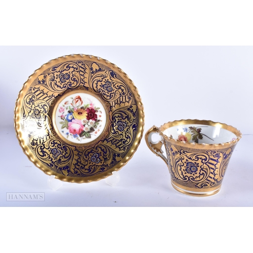 162 - A PAIR OF EARLY 19TH CENTURY CHAMBERLAINS WORCESTER CUPS AND SAUCERS painted with flowers. 15cm wide... 