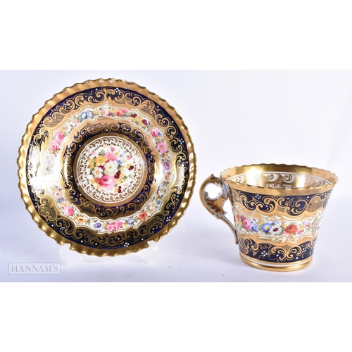 162 - A PAIR OF EARLY 19TH CENTURY CHAMBERLAINS WORCESTER CUPS AND SAUCERS painted with flowers. 15cm wide... 