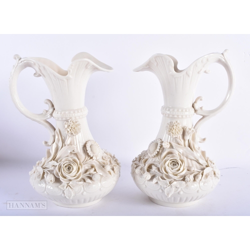 170 - A LARGE PAIR OF IRISH BELEEK PORCELAIN JUGS. 23.5 cm high.