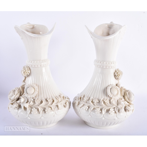 170 - A LARGE PAIR OF IRISH BELEEK PORCELAIN JUGS. 23.5 cm high.