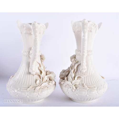 170 - A LARGE PAIR OF IRISH BELEEK PORCELAIN JUGS. 23.5 cm high.