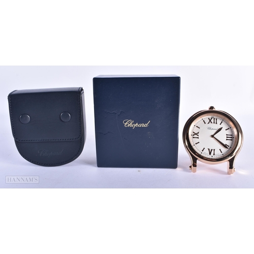 171 - A LOVELY CHOPARD BOXED TABLE CLOCK within a rose metal surround. 10 cm wide. Running