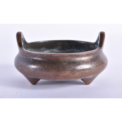 172 - A CHINESE TWIN HANDLED BRONZE CENSER. 311 grams. 8 cm wide.