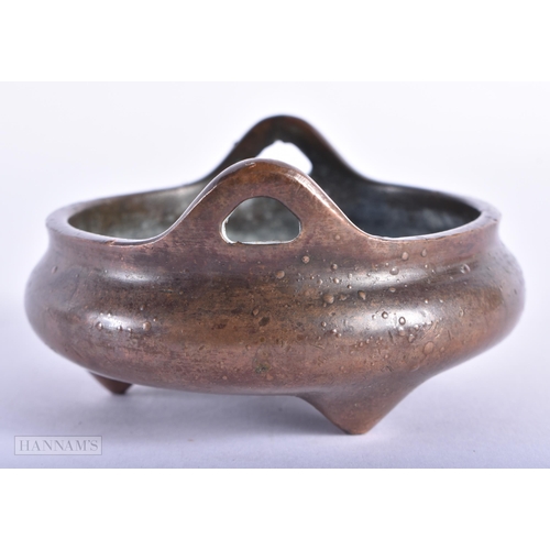 172 - A CHINESE TWIN HANDLED BRONZE CENSER. 311 grams. 8 cm wide.